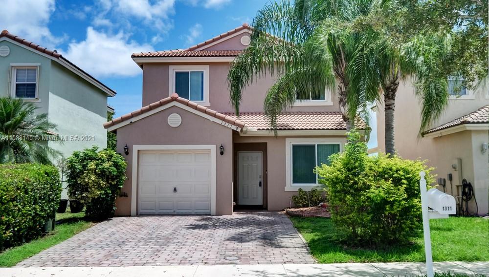 1311 Southeast 20th Road, Unit 1311 Homestead, FL 33035 - Photo 1 of 40 a house view with a outdoor space