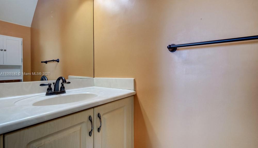 1311 Southeast 20th Road, Unit 1311 Homestead, FL 33035 - Photo 20 of 40 a bathroom with a sink and a mirror