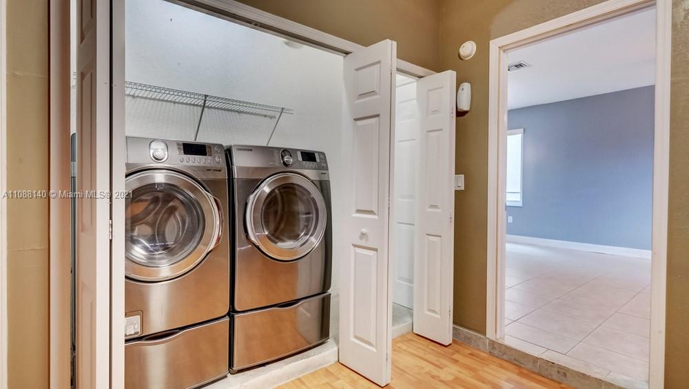 1311 Southeast 20th Road, Unit 1311 Homestead, FL 33035 - Photo 23 of 40 a utility room with dryer and washer