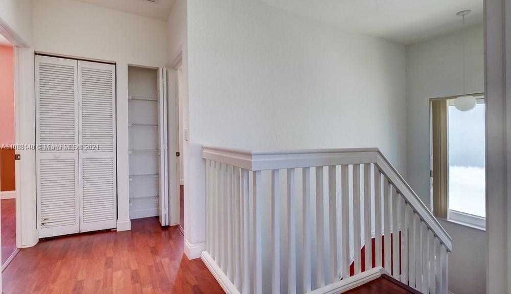 1311 Southeast 20th Road, Unit 1311 Homestead, FL 33035 - Photo 24 of 40 a view of a hallway with wooden floor
