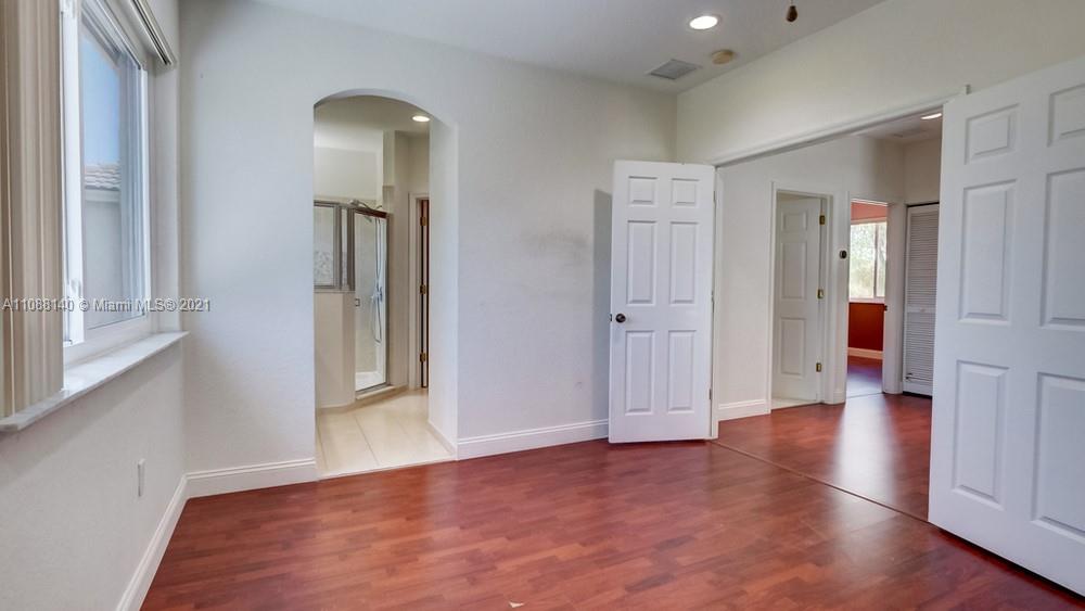 1311 Southeast 20th Road, Unit 1311 Homestead, FL 33035 - Photo 28 of 40 a view of a room with wooden floor and window