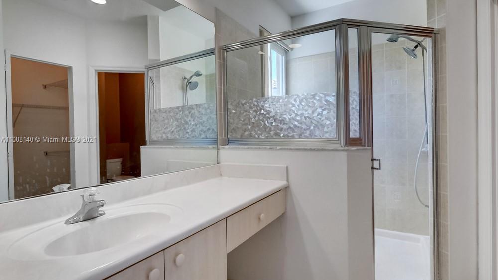 1311 Southeast 20th Road, Unit 1311 Homestead, FL 33035 - Photo 29 of 40 a bathroom with a sink and mirror