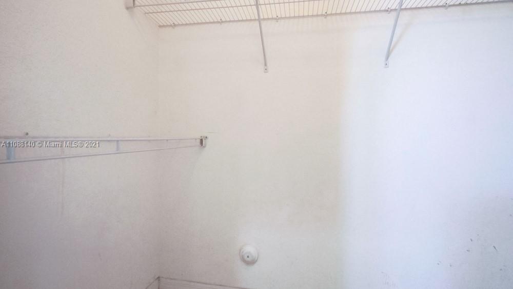 1311 Southeast 20th Road, Unit 1311 Homestead, FL 33035 - Photo 31 of 40 a view of a rack on the wall