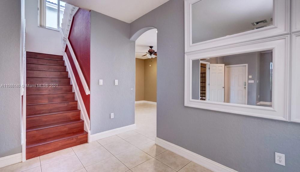 1311 Southeast 20th Road, Unit 1311 Homestead, FL 33035 - Photo 8 of 40 a view of entryway and hall with wooden floor