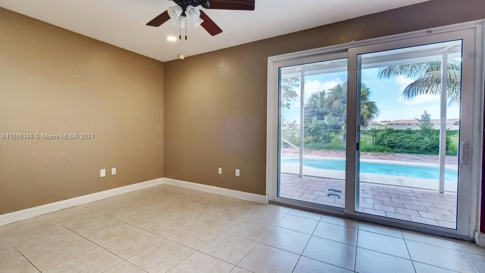 1311 Southeast 20th Road, Unit 1311 Homestead, FL 33035 - Photo 9 of 40 a view of an empty room with a window