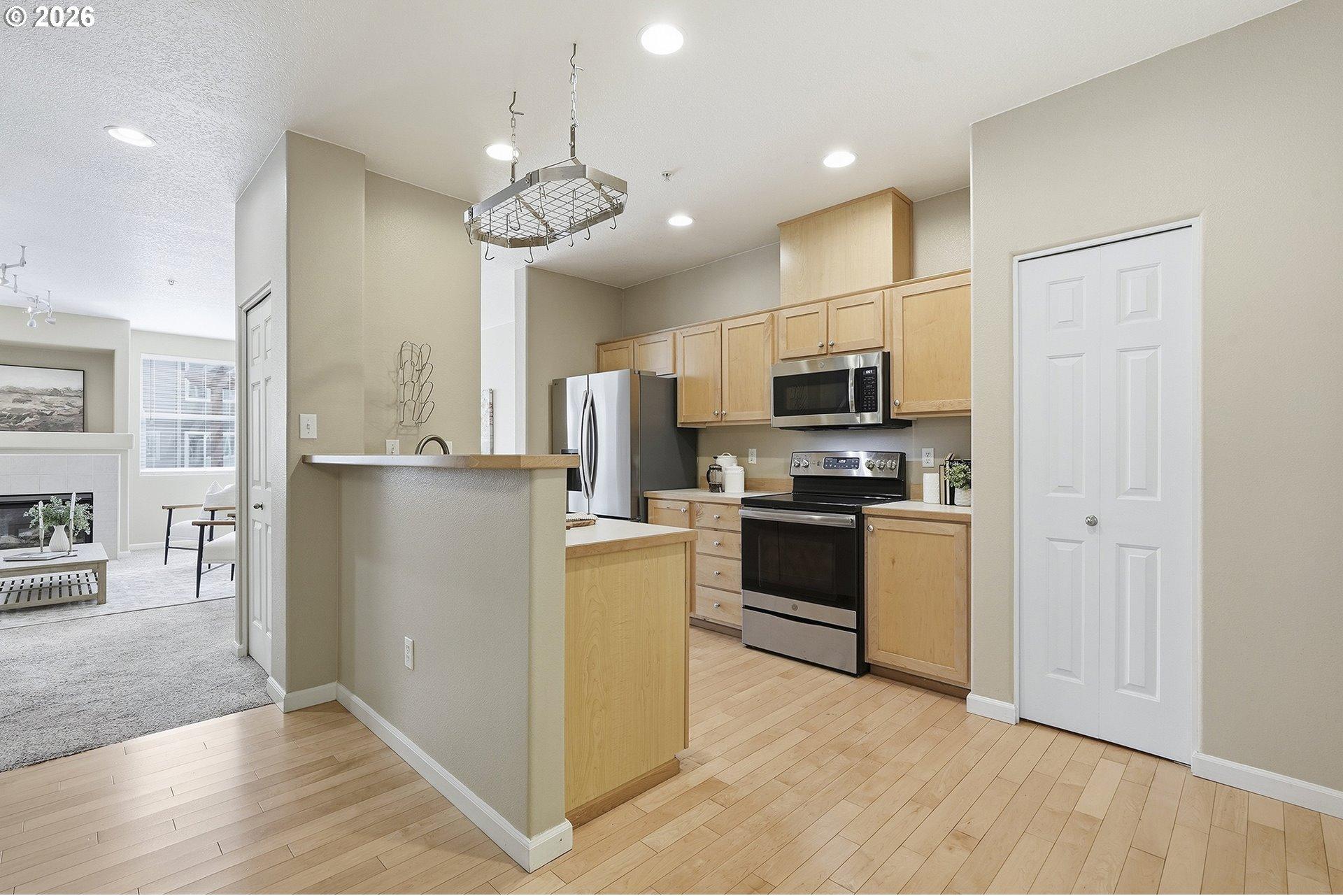 15430 Southwest Sparrow Loop, Unit 105 Beaverton, OR 97007 - Photo 16 of 43 Kitchen/Living Room