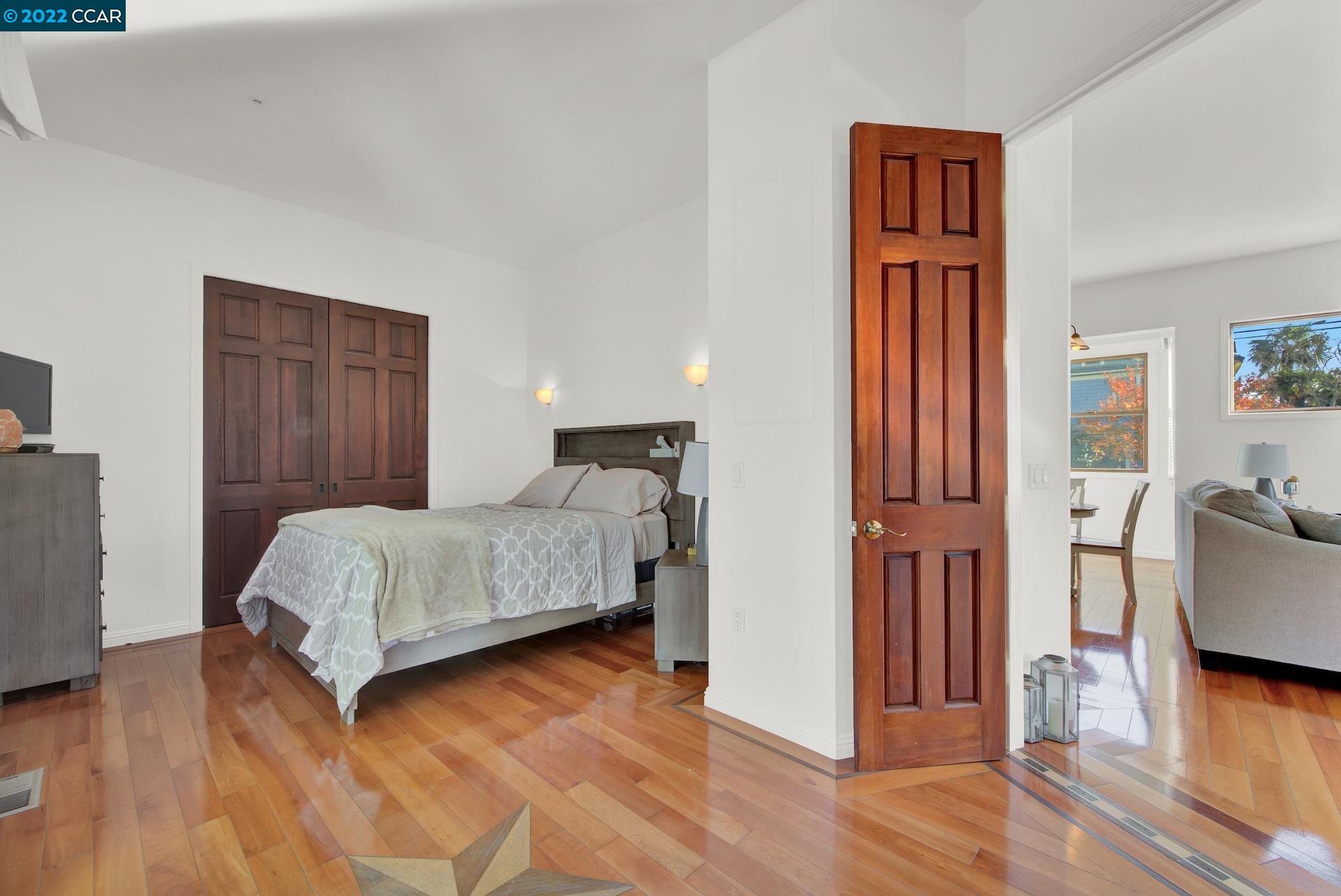 2004 Main Street Napa, CA 94559 - Photo 5 of 7 a bedroom with a bed and wooden floor