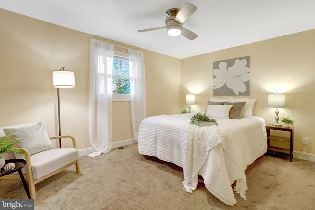 a bed room with a bed and a chandelier