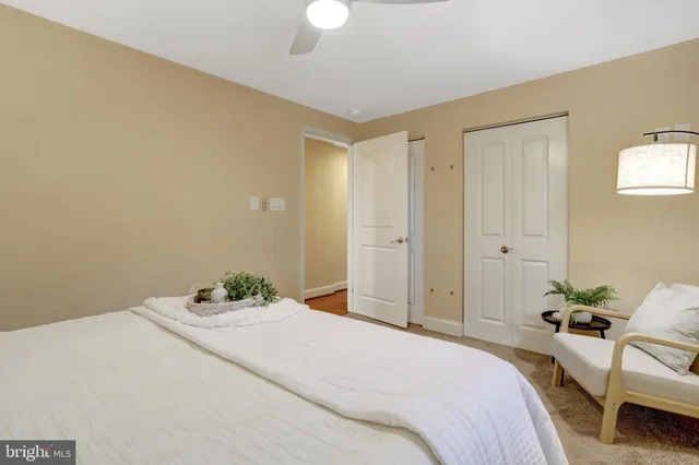 a bedroom with a bed and a table