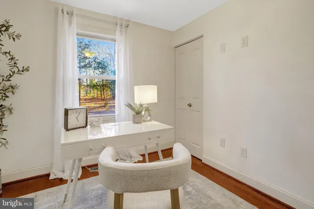 a bathroom with a sink a toilet and a window