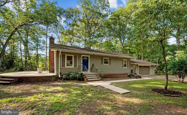 a house with trees in front of it