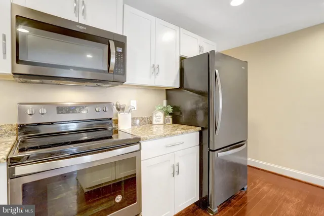 a kitchen with a stove microwave and refrigerator