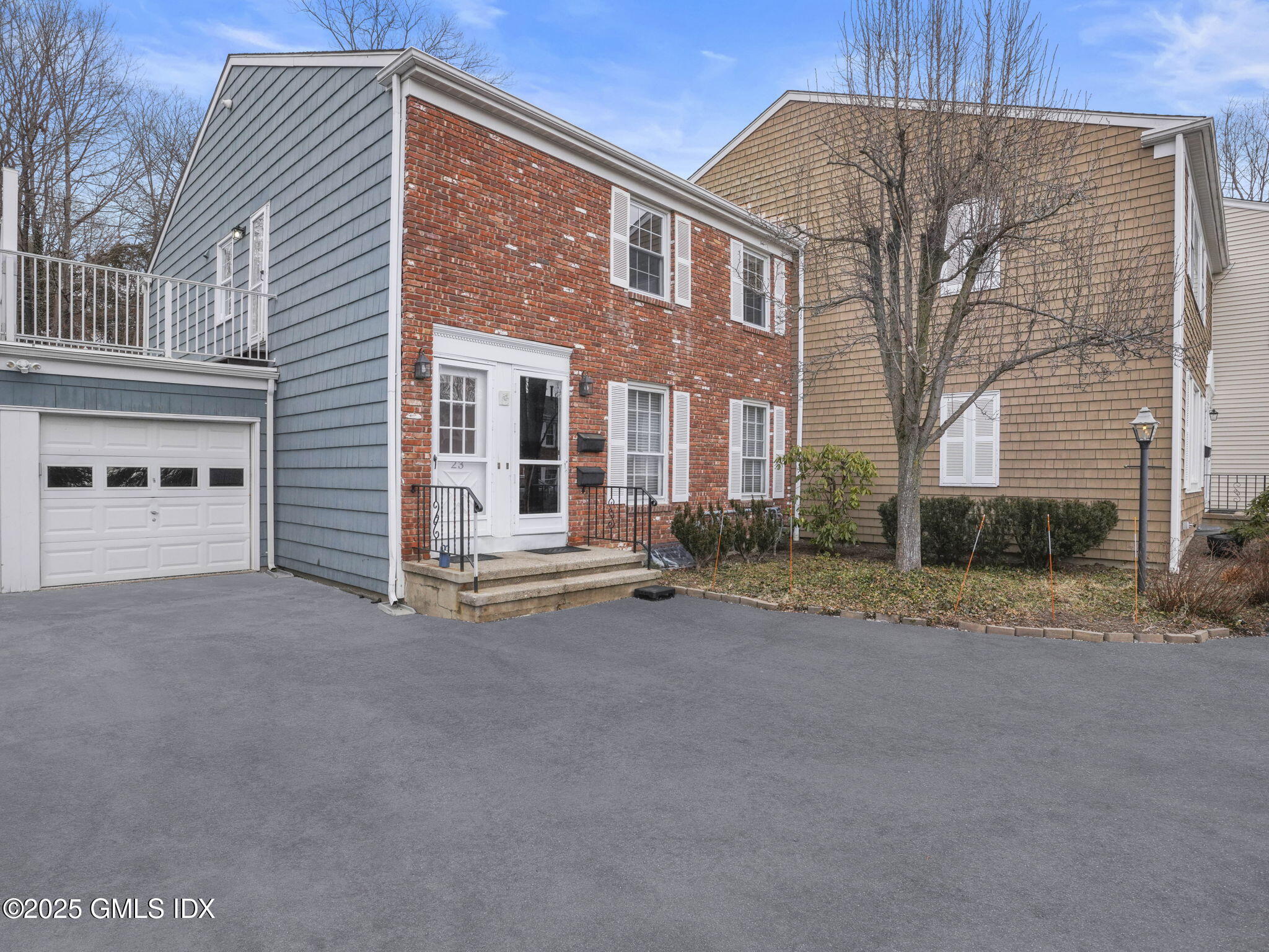 102 Valley Road, Unit 23 Cos Cob, CT 06807 - Photo 2 of 13 a view of a house with a street