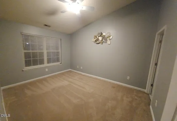 a view of empty room with windows