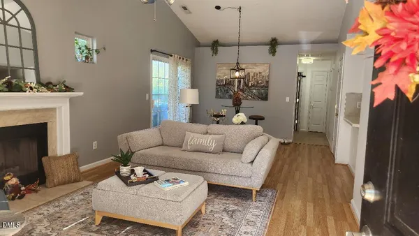 a living room with furniture and a fireplace