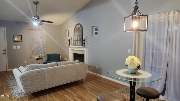 a living room with furniture and a lamp