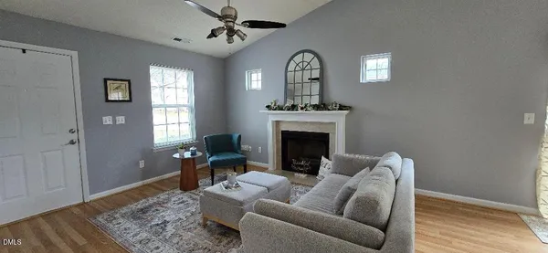 a living room with furniture and a fireplace