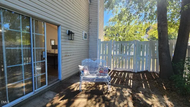 a view of balcony with wooden floor and fence