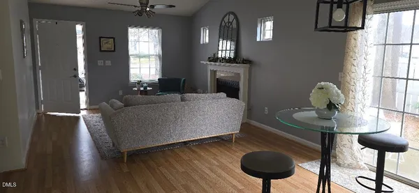 a living room with furniture and a chandelier