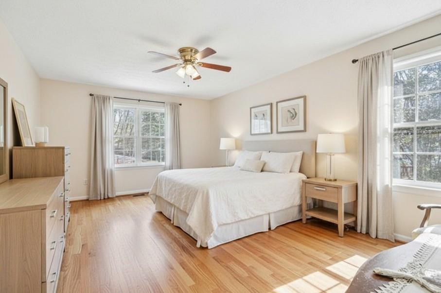 1940 Commonwealth Court Cumming, GA 30041 - Photo 14 of 29 a spacious bedroom with a large bed and a window