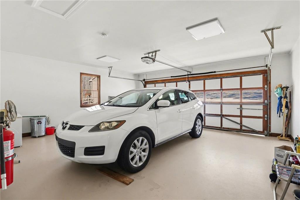 1940 Commonwealth Court Cumming, GA 30041 - Photo 25 of 29 a car and bike parked in a room