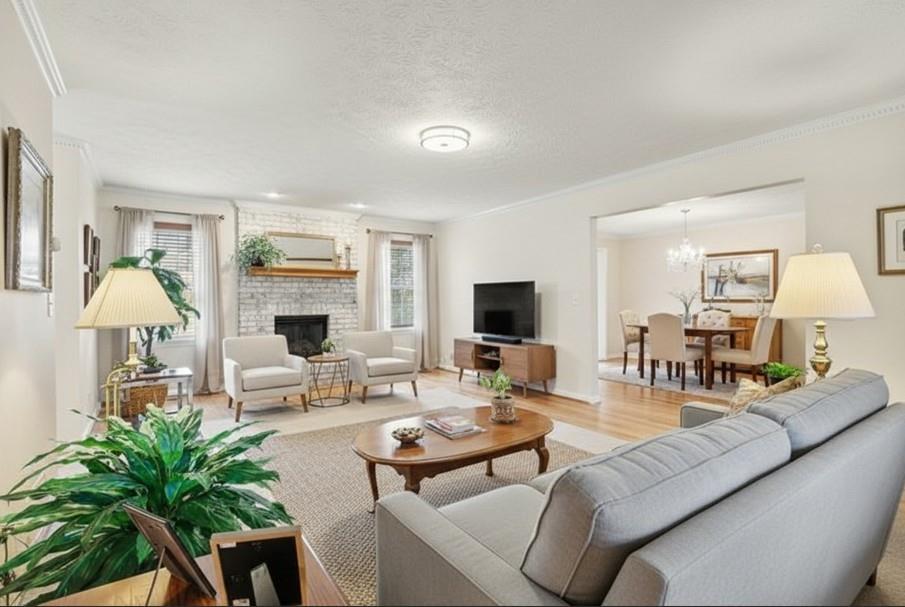 1940 Commonwealth Court Cumming, GA 30041 - Photo 4 of 29 a living room with furniture and a flat screen tv