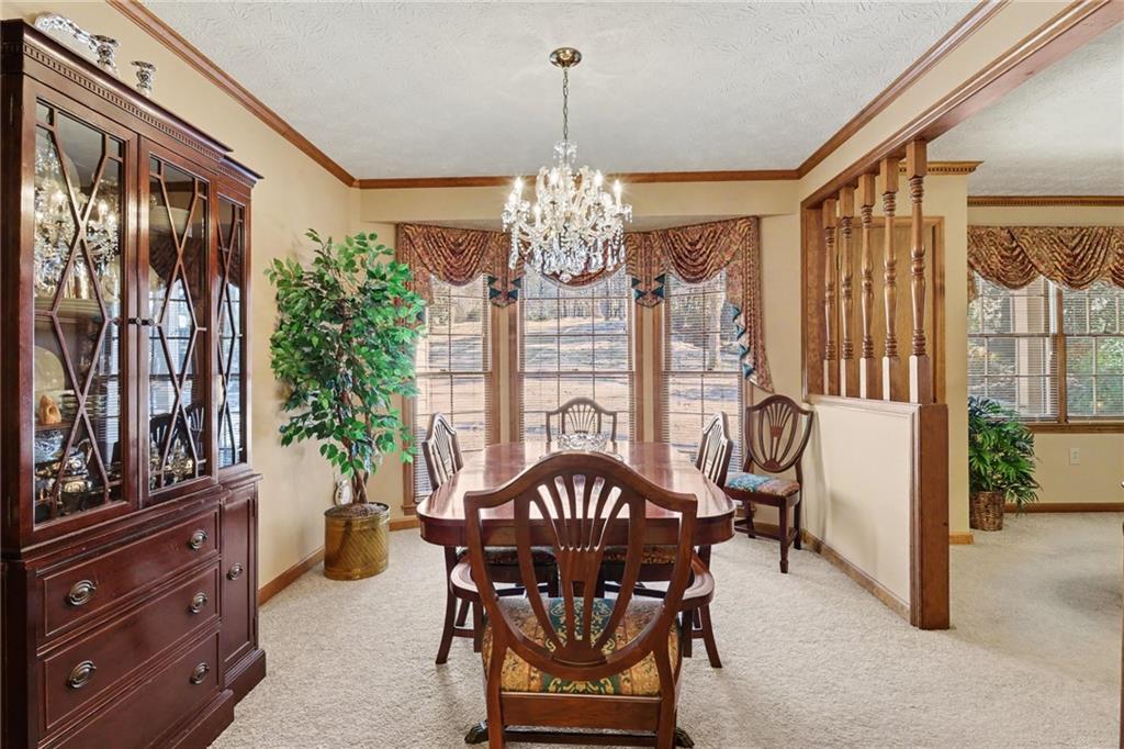 1940 Commonwealth Court Cumming, GA 30041 - Photo 9 of 29 a view of a dining room with furniture window and outside view