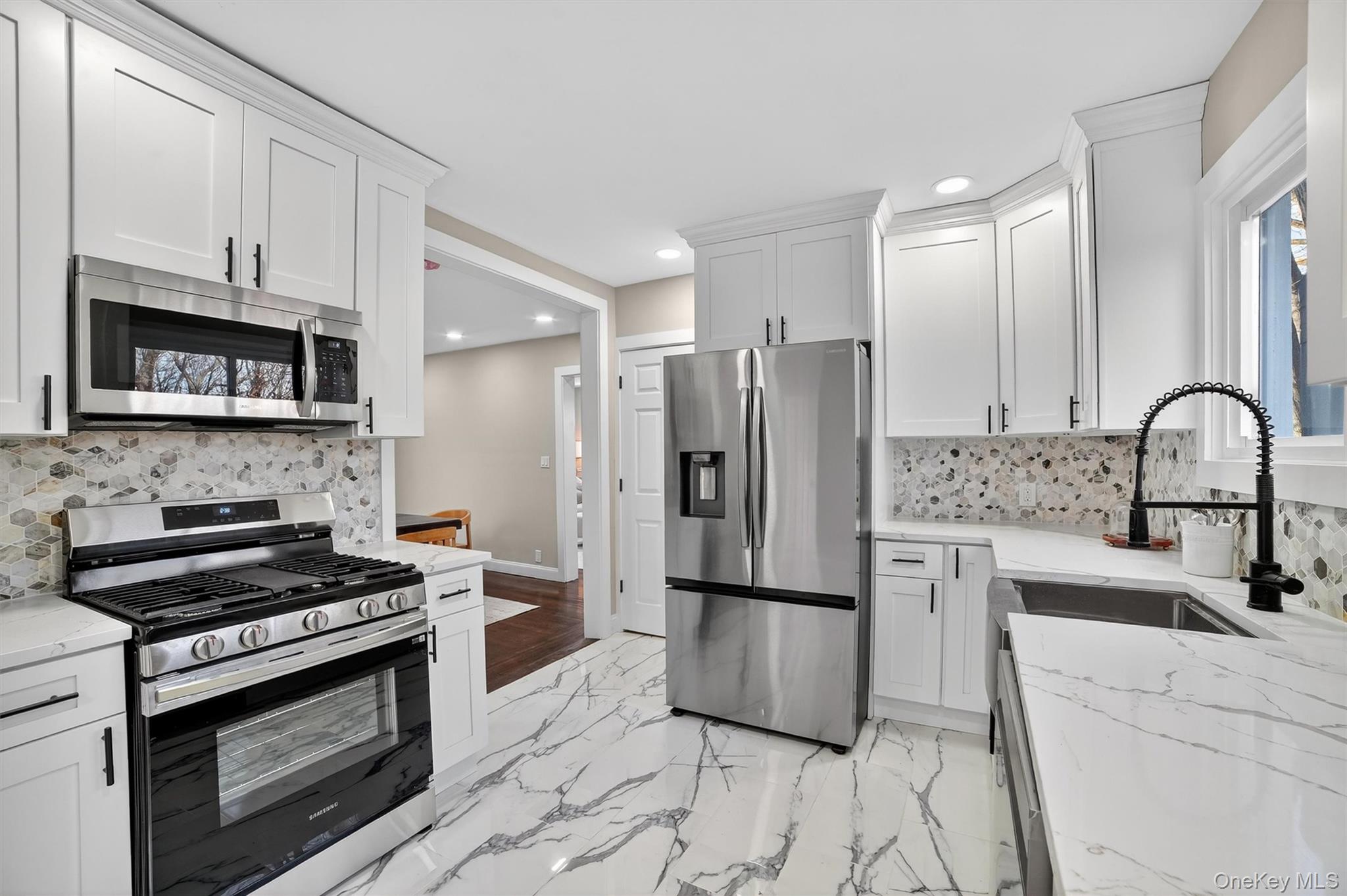 94 Jervis Road Yonkers, NY 10705 - Photo 15 of 50 a kitchen with granite countertop a refrigerator stove and microwave