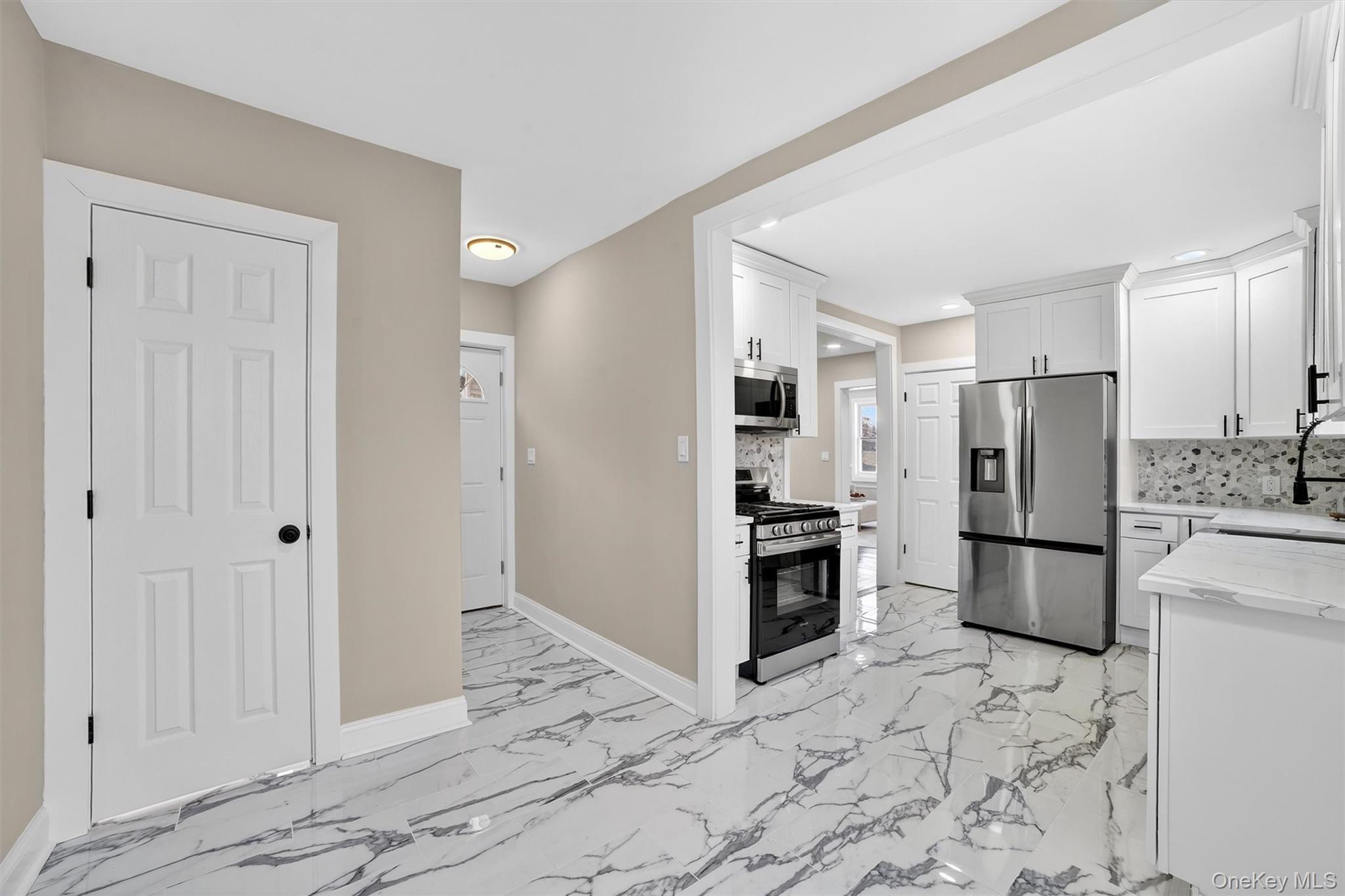 94 Jervis Road Yonkers, NY 10705 - Photo 16 of 50 a kitchen with a refrigerator a stove and a sink