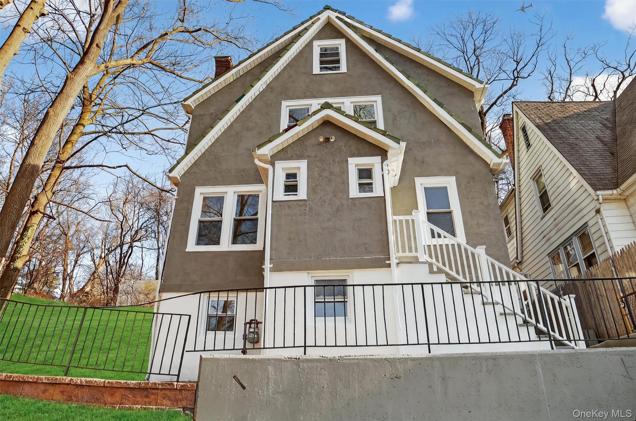 94 Jervis Road Yonkers, NY 10705 - Photo 2 of 50 a front view of a house with a yard