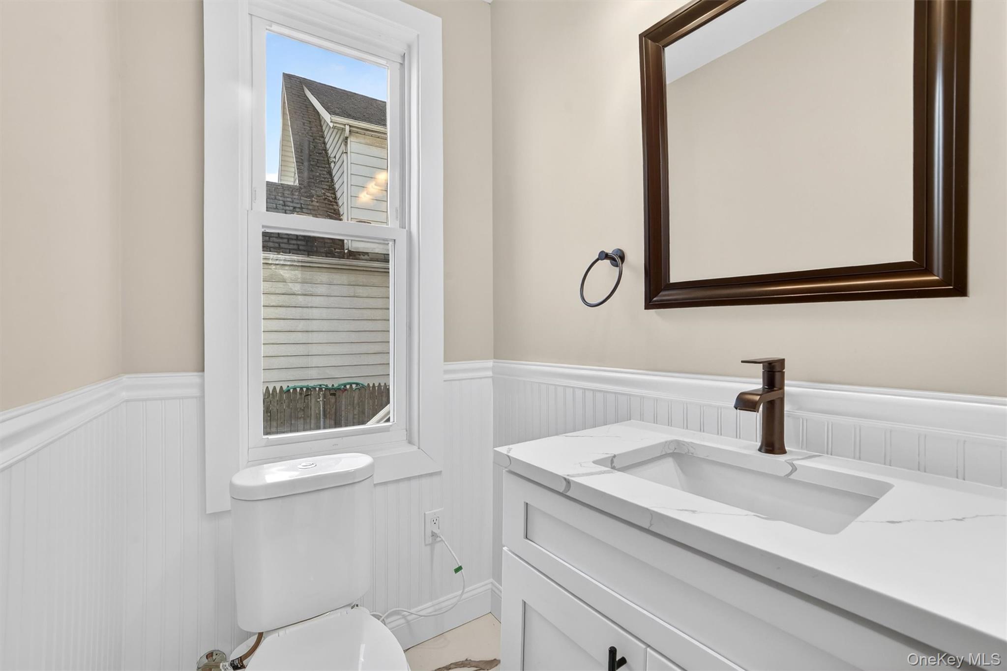 94 Jervis Road Yonkers, NY 10705 - Photo 22 of 50 a bathroom with a sink and a mirror