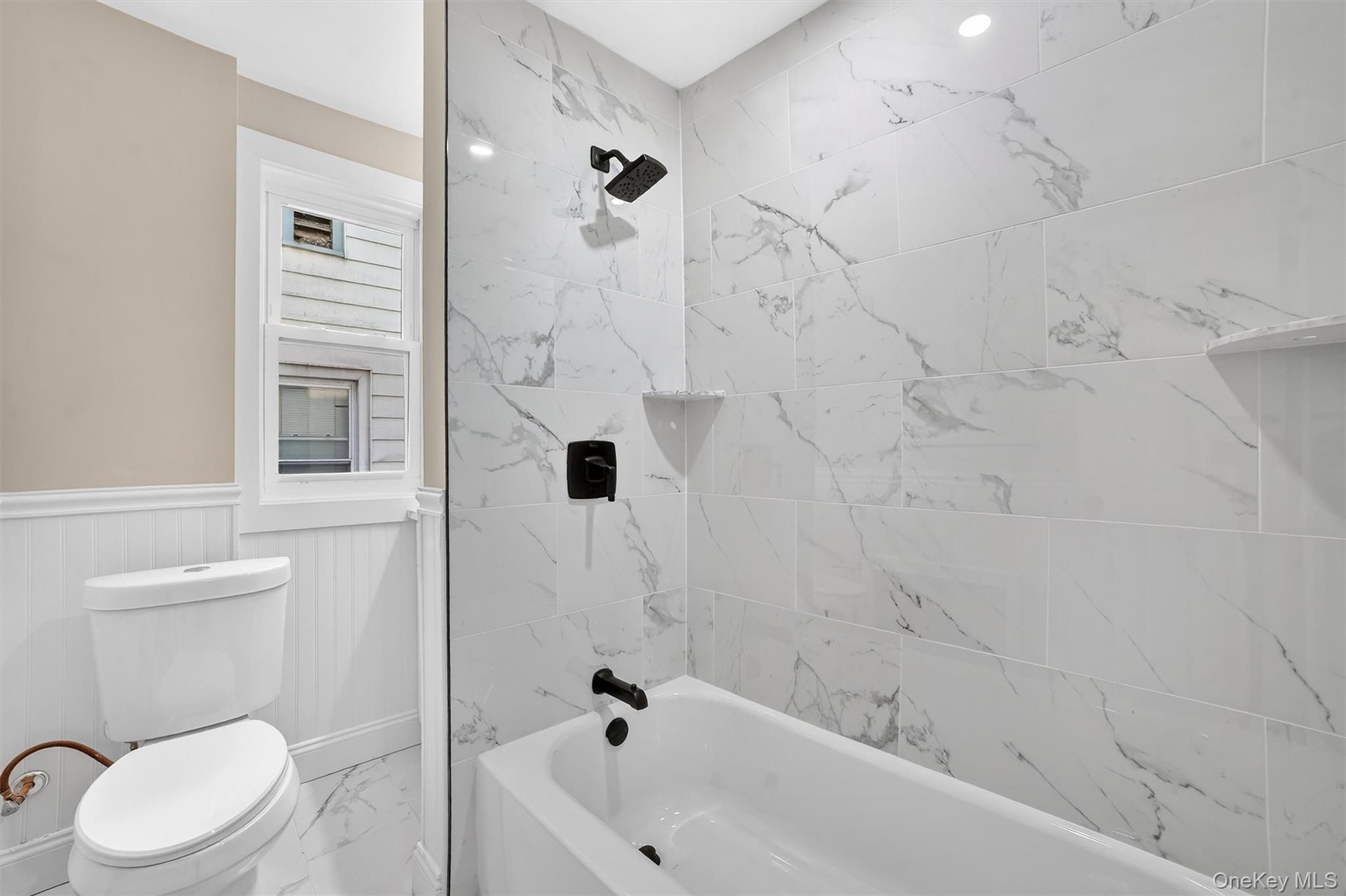 94 Jervis Road Yonkers, NY 10705 - Photo 29 of 50 a bathroom with a sink toilet and shower