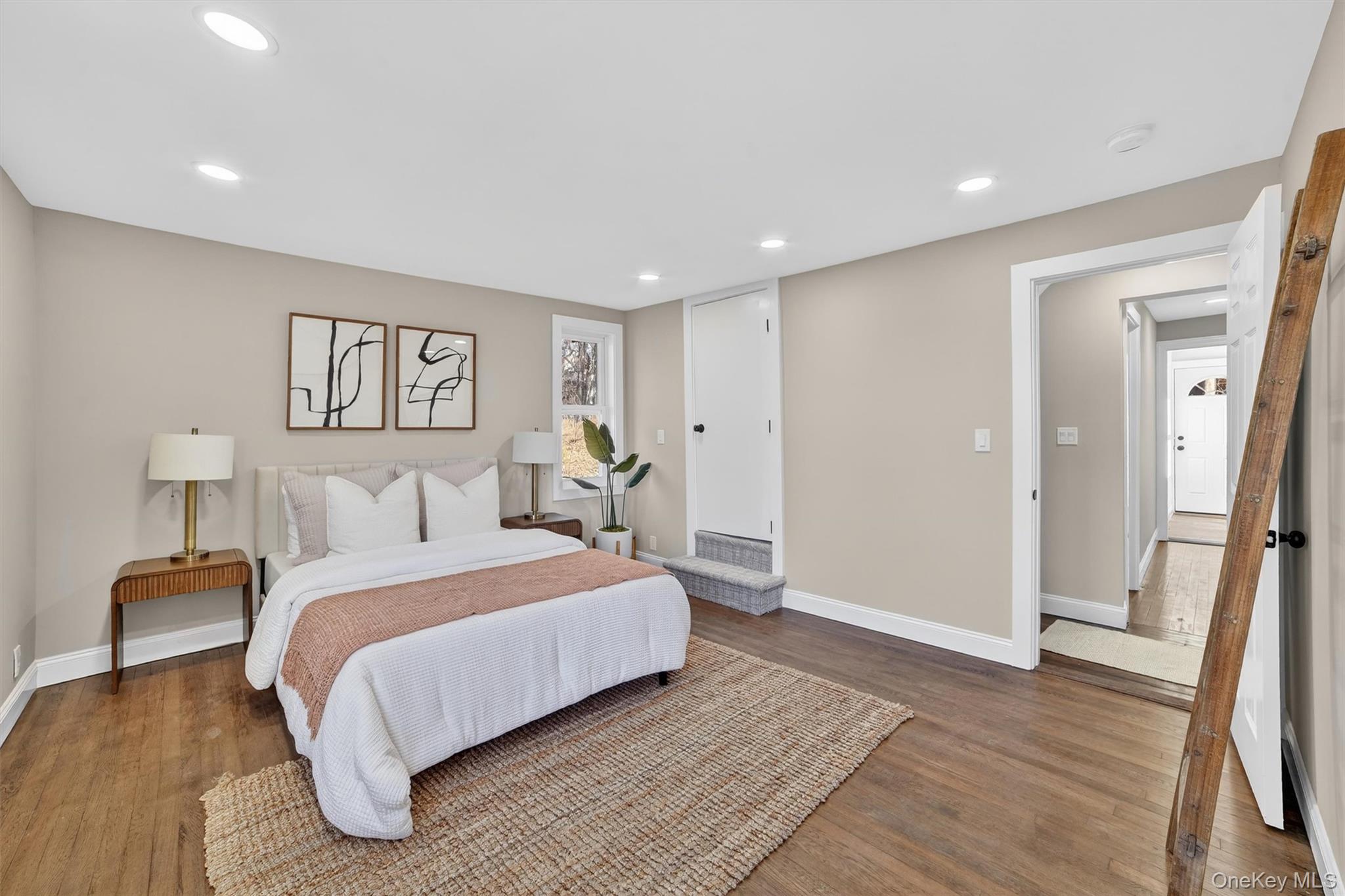 94 Jervis Road Yonkers, NY 10705 - Photo 30 of 50 a spacious bedroom with a bed and a walk in closet