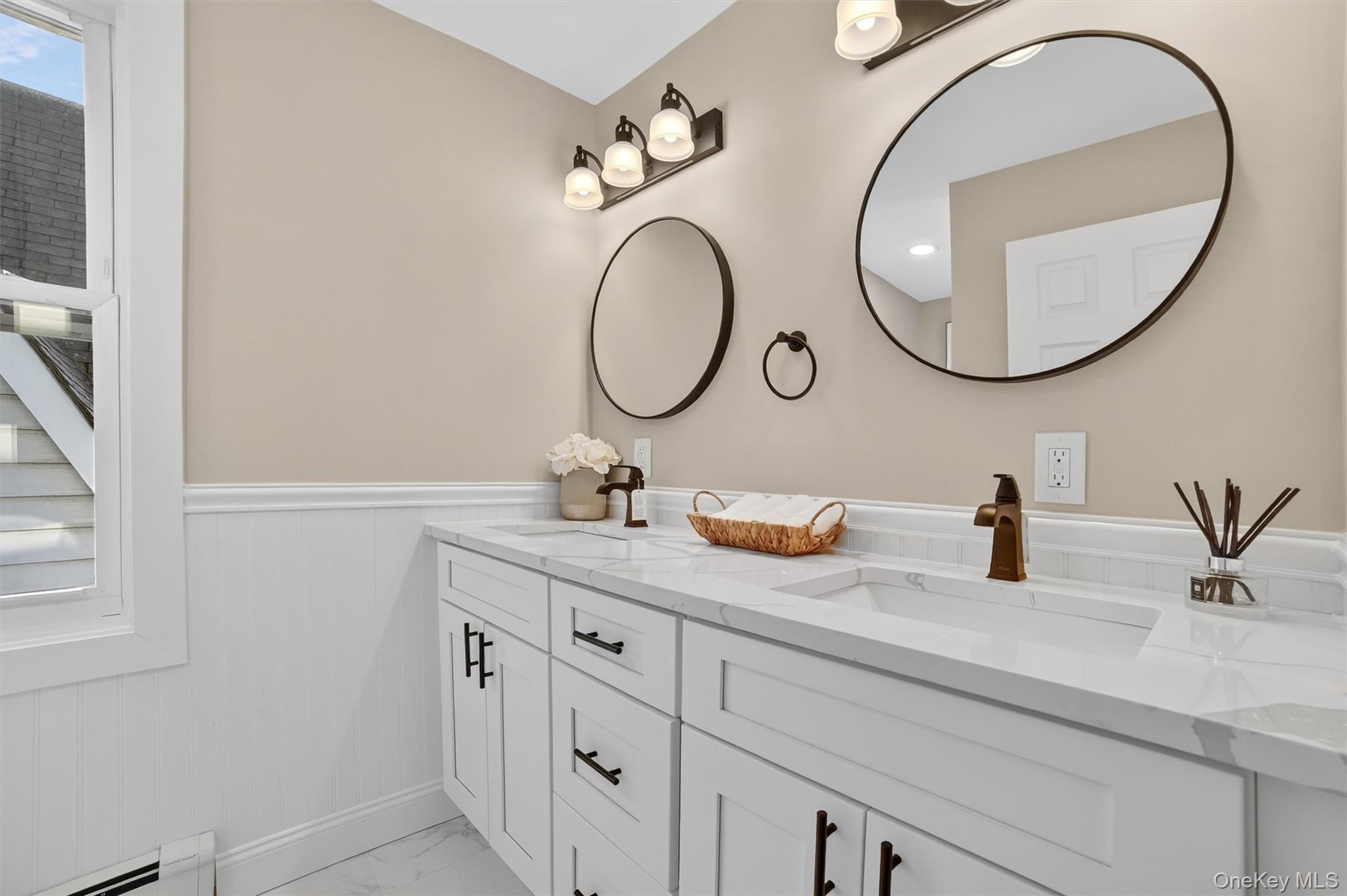 94 Jervis Road Yonkers, NY 10705 - Photo 34 of 50 a bathroom with a granite countertop sink and a mirror