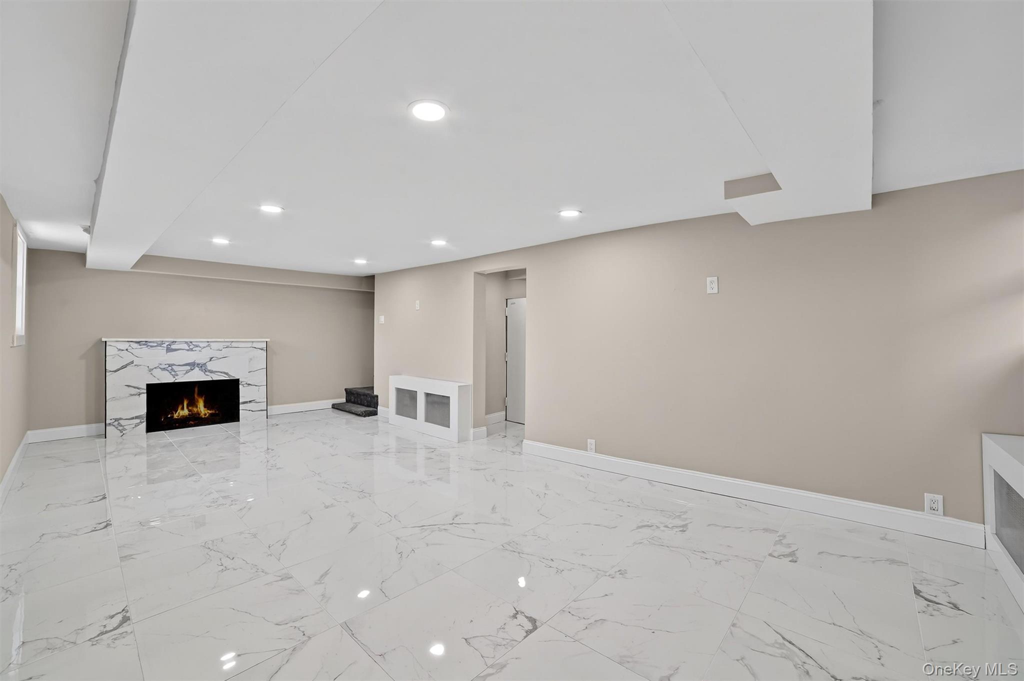 94 Jervis Road Yonkers, NY 10705 - Photo 43 of 50 a view of an empty room with a fireplace