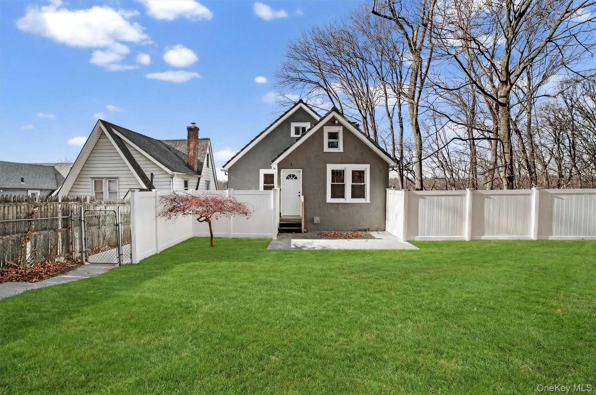 94 Jervis Road Yonkers, NY 10705 - Photo 49 of 50 a front view of a house with a yard