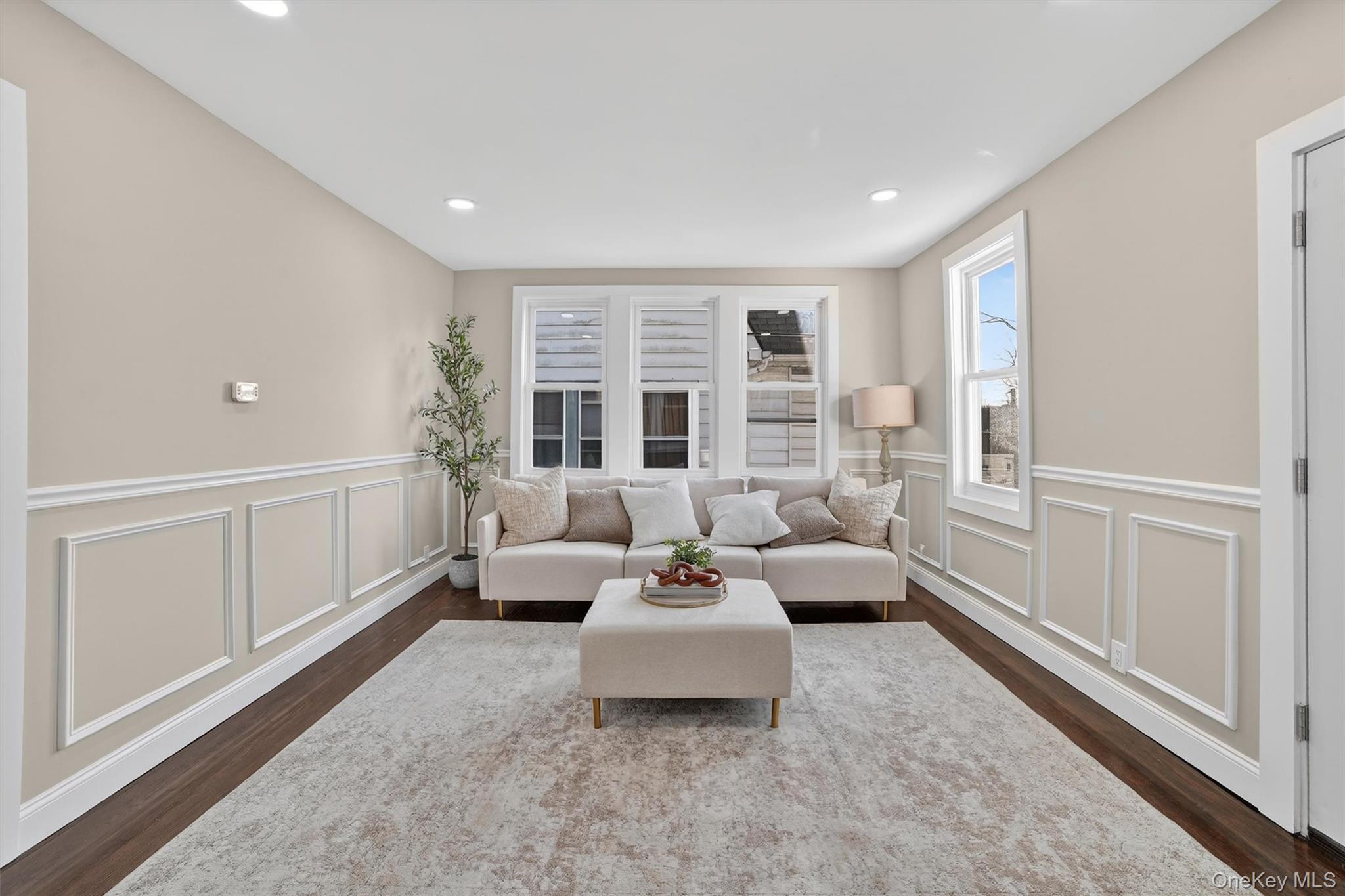 94 Jervis Road Yonkers, NY 10705 - Photo 5 of 50 a living room with furniture and large windows