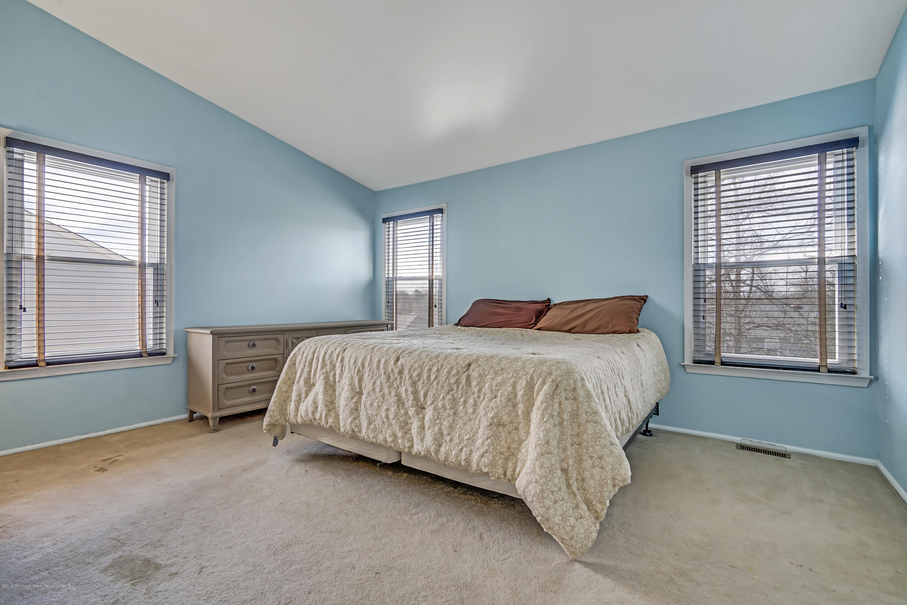 59 Marc Drive Howell, NJ 07731 - Photo 12 of 24 a bed sitting in a bedroom next to a window