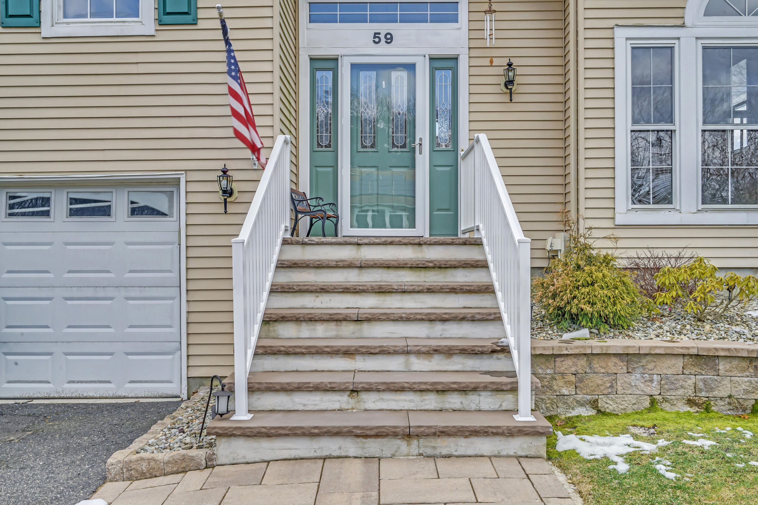 59 Marc Drive Howell, NJ 07731 - Photo 2 of 24 a front view of a house with a porch