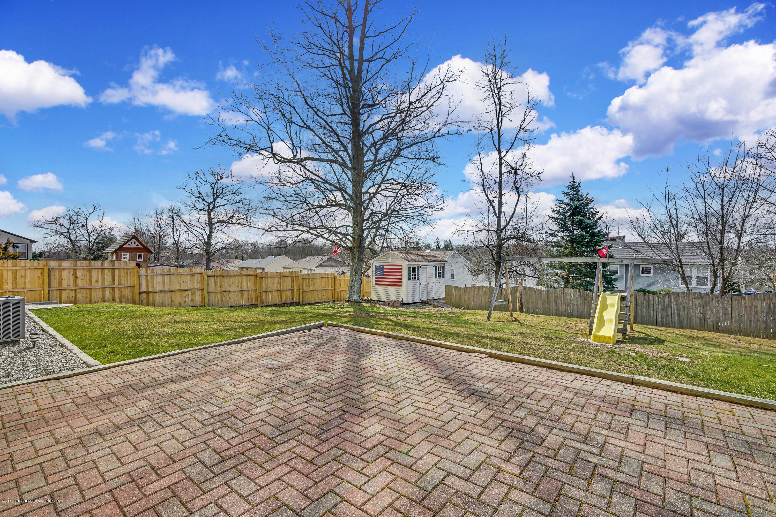 59 Marc Drive Howell, NJ 07731 - Photo 21 of 24 a view of swimming pool with yard and tree in the background