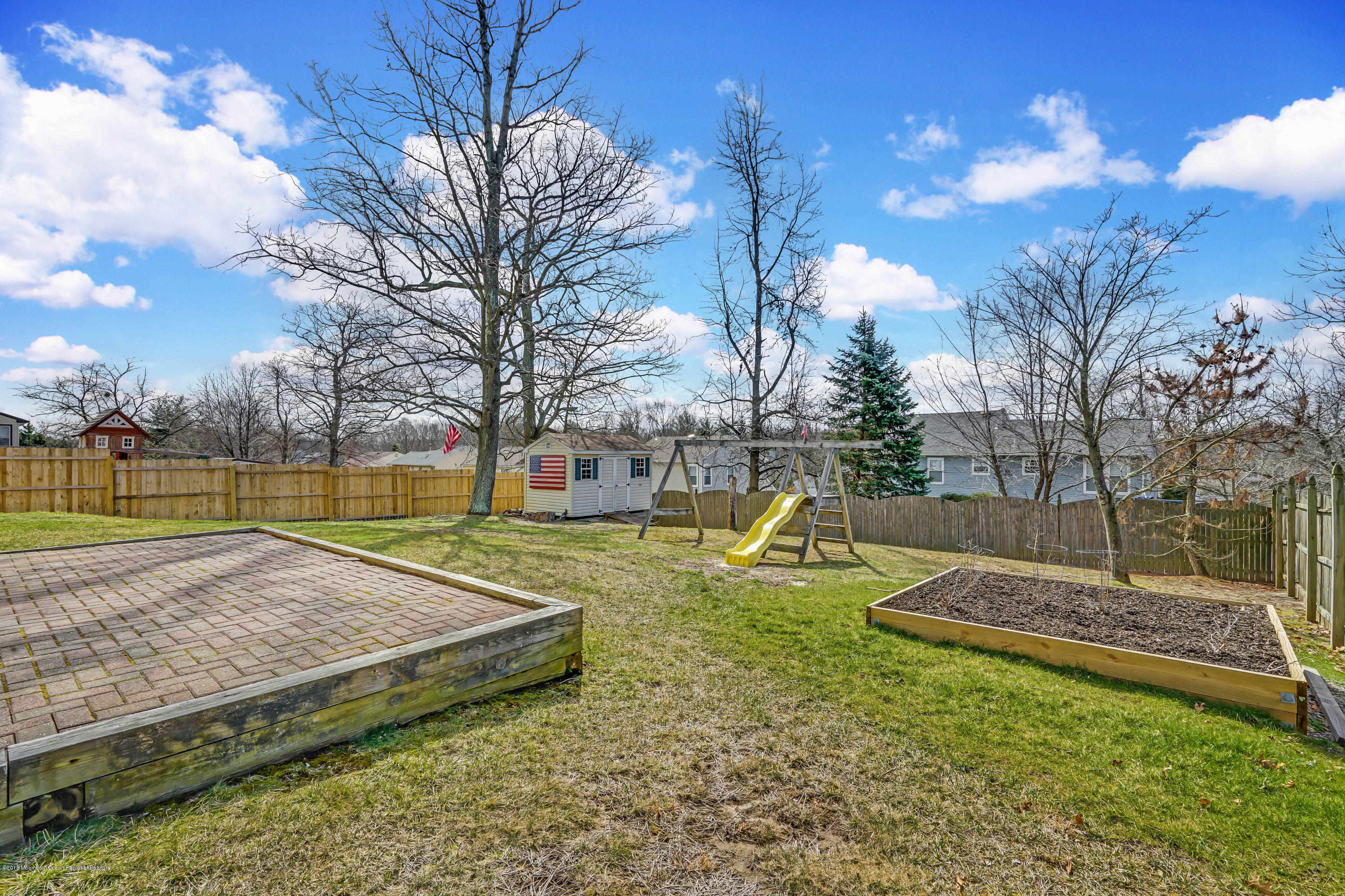 59 Marc Drive Howell, NJ 07731 - Photo 22 of 24 a view of a backyard with swimming pool