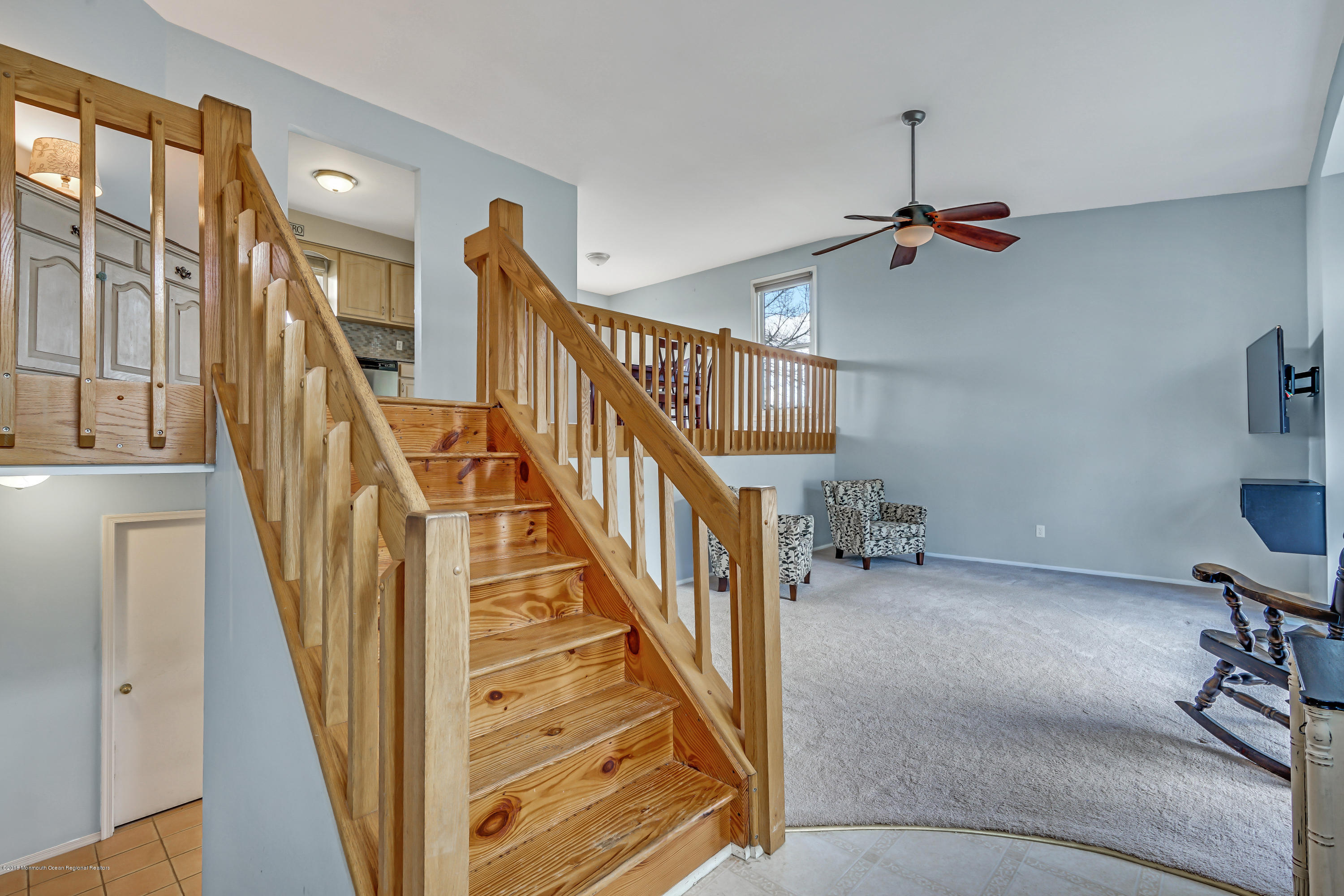 59 Marc Drive Howell, NJ 07731 - Photo 3 of 24 a view of staircase with lots of frames and wooden floor