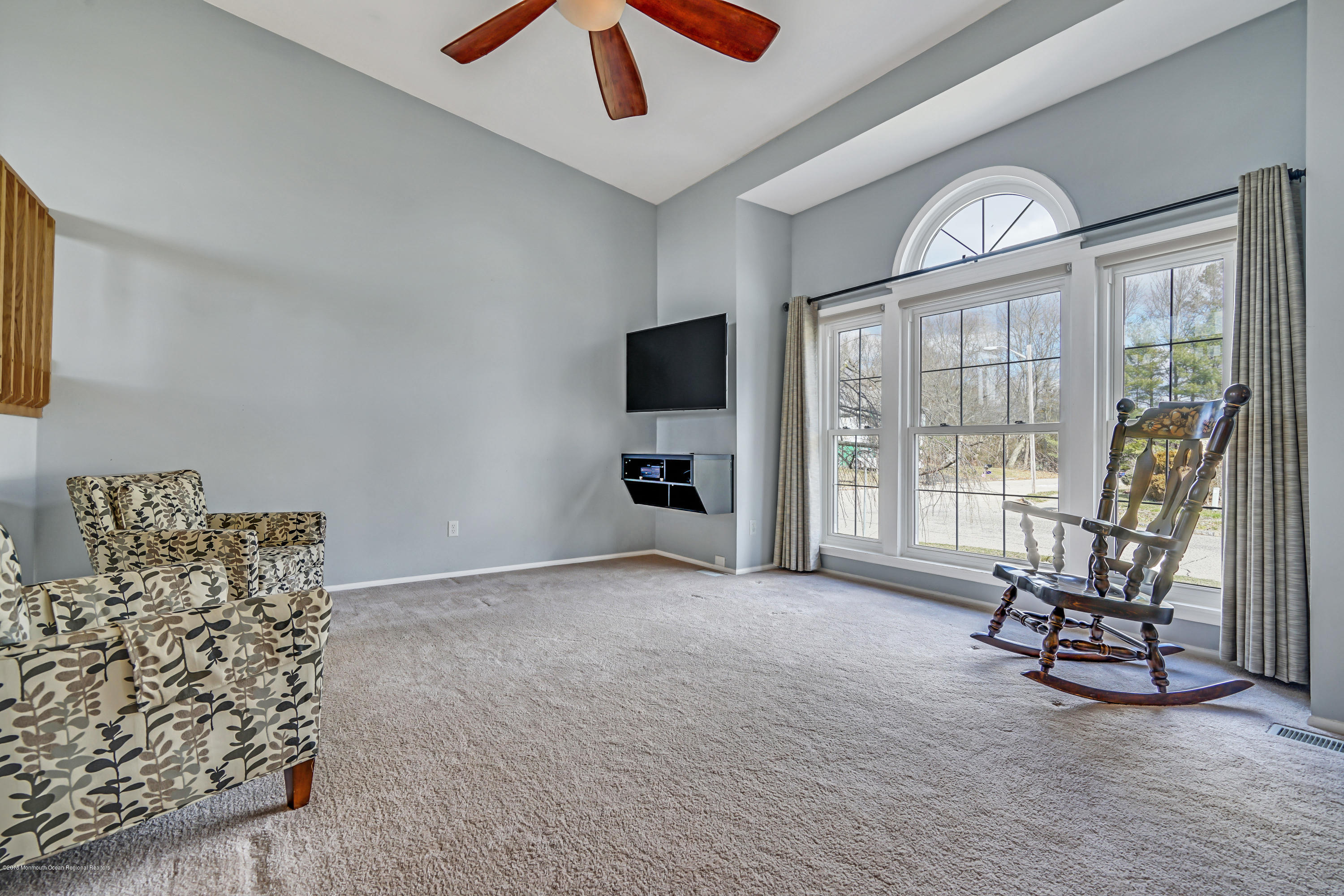 59 Marc Drive Howell, NJ 07731 - Photo 5 of 24 a view of an empty room with furniture and a window