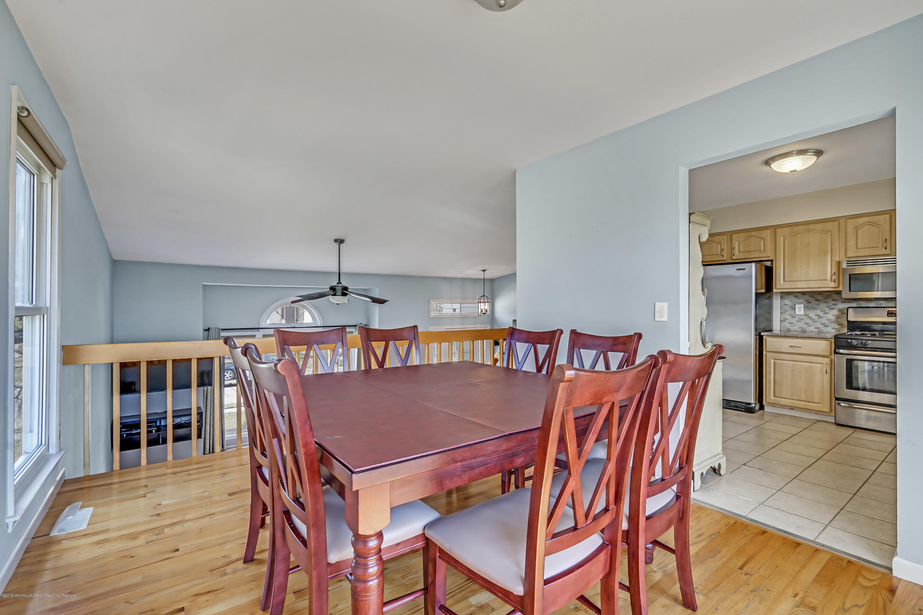 59 Marc Drive Howell, NJ 07731 - Photo 7 of 24 a dining room with furniture a chandelier and wooden floor