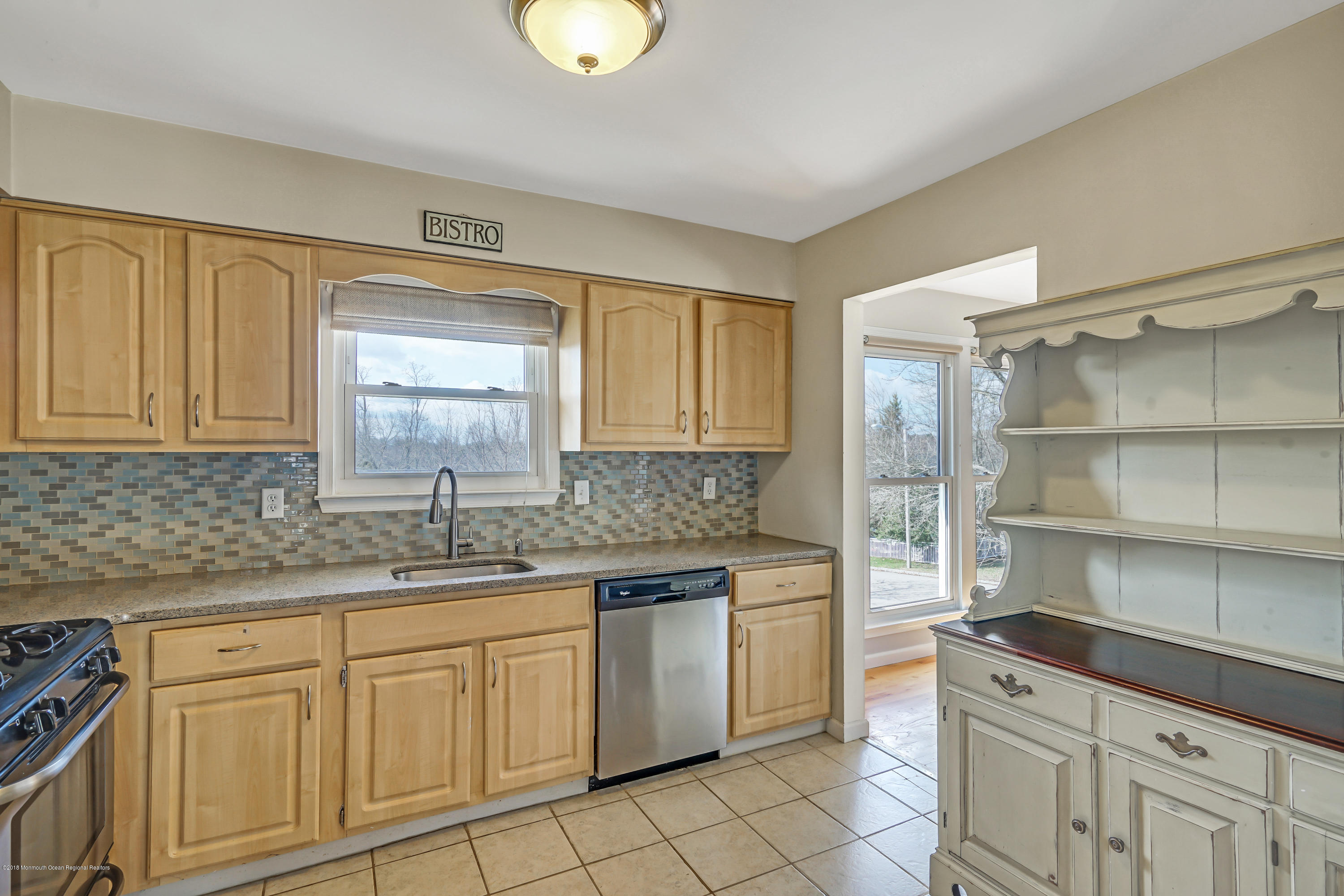 59 Marc Drive Howell, NJ 07731 - Photo 10 of 24 a kitchen with a sink dishwasher stove and cabinets