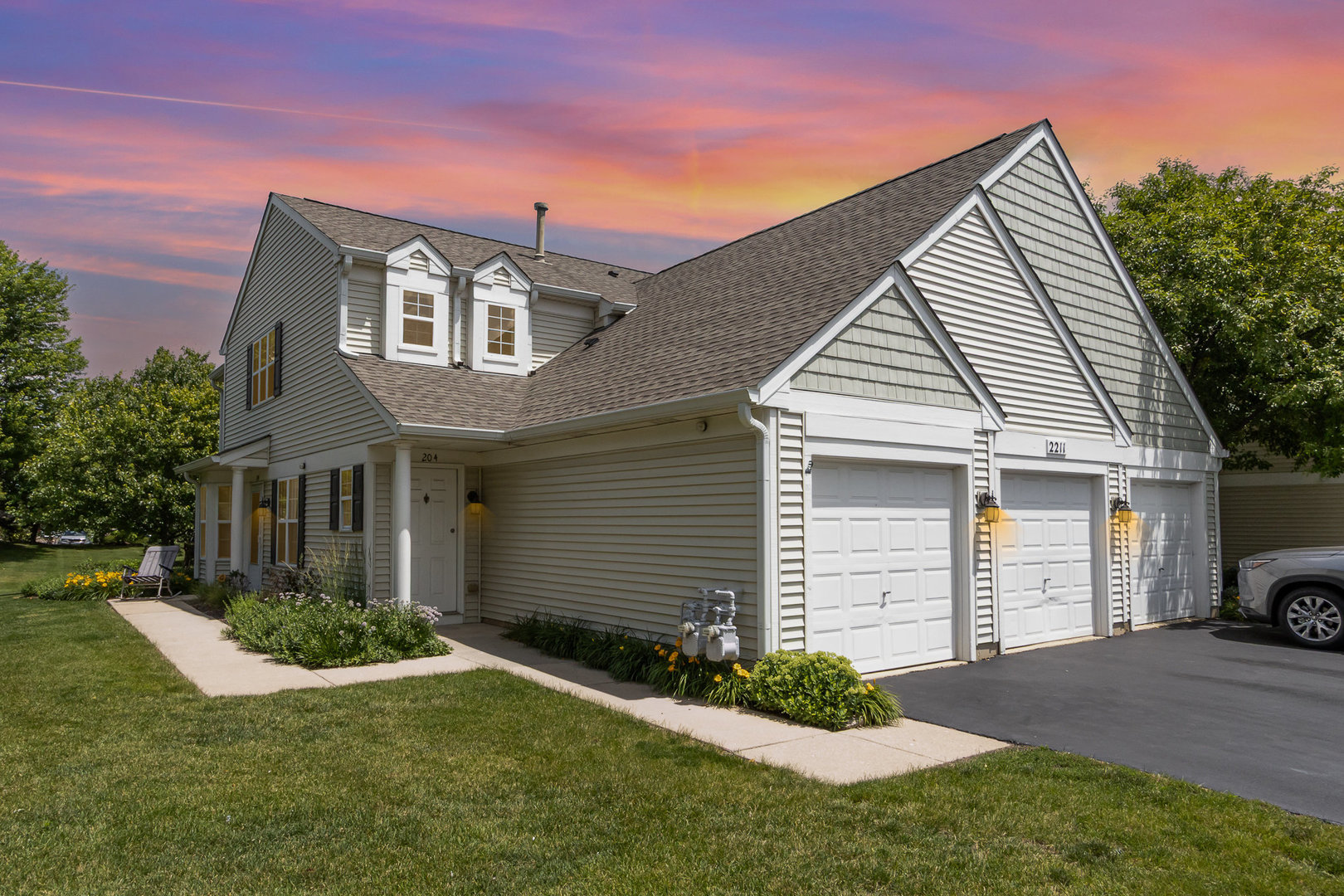 2211 Waterleaf Court, Unit 204 Naperville, IL 60564 - Photo 1 of 17 a front view of a house with a yard