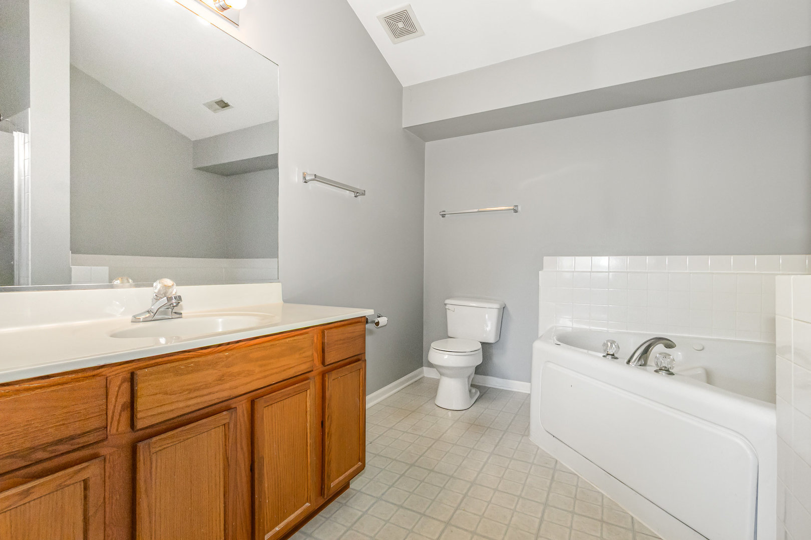 2211 Waterleaf Court, Unit 204 Naperville, IL 60564 - Photo 13 of 17 a bathroom with a sink and a toilet