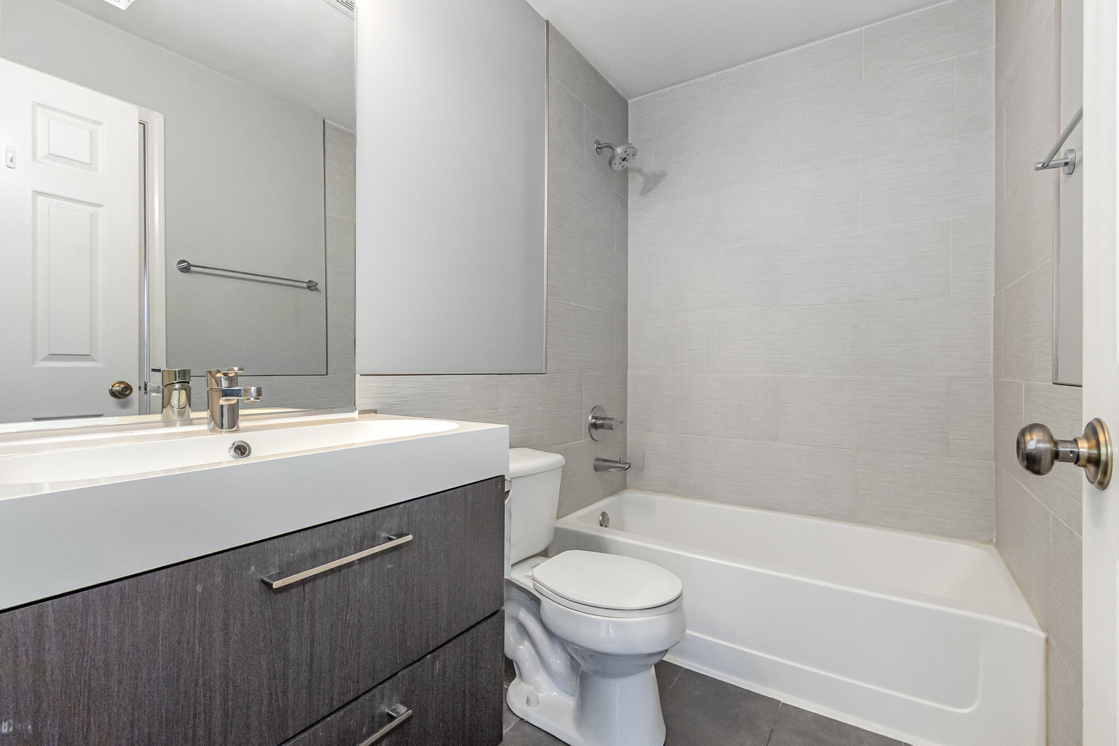 2211 Waterleaf Court, Unit 204 Naperville, IL 60564 - Photo 9 of 17 a bathroom with a sink mirror toilet and bathtub