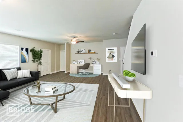 a living room with furniture and a table