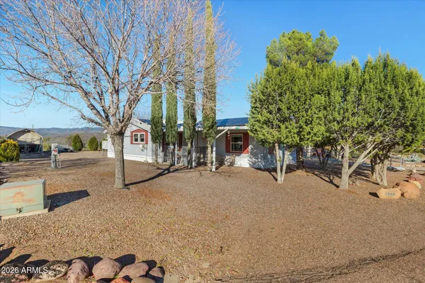 a view of a street with a building in the background